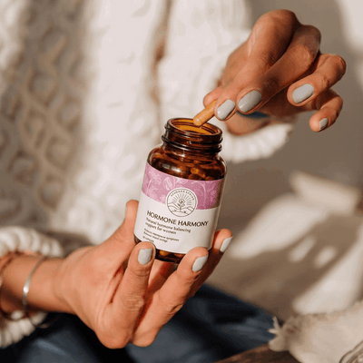 Hormone Harmony 60 vegetable capsules held in two hands